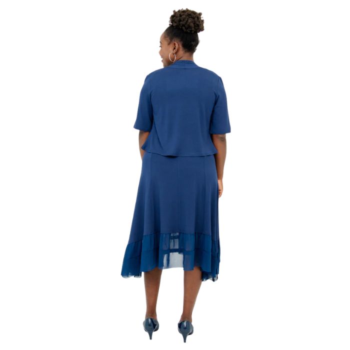 female model wearing indigo blue doda jacket and indigo blue danube dress back view on white background