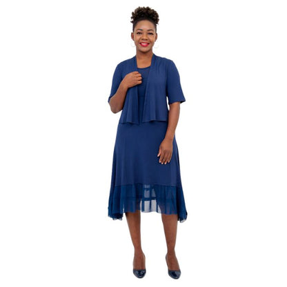 female model wearing indigo blue doda jacket and indigo blue danube dress front view on white background