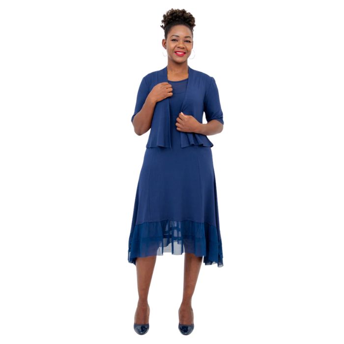 female model wearing indigo blue doda jacket and indigo blue danube dress front view on white background