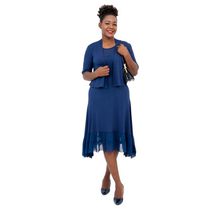 female model wearing indigo blue doda jacket and indigo blue danube dress front view on white background