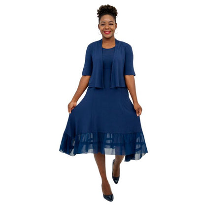 female model wearing indigo blue doda jacket and indigo blue danube dress front view on white background