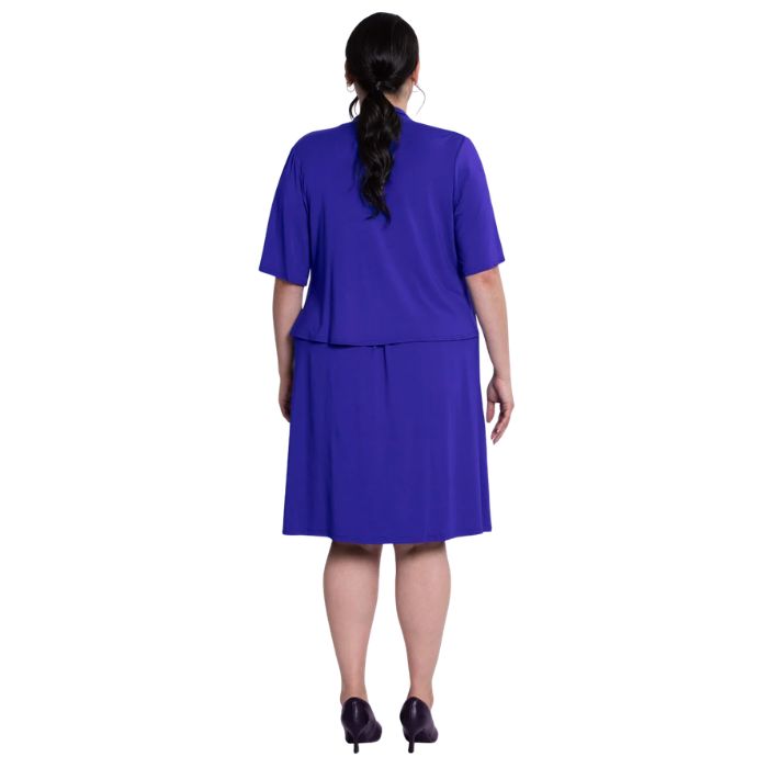 female model wearing violet purple doda jacket and violet purple roam dress back view on white background