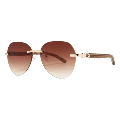 dragon frameless style sunglasses with tan brown lenses over view of sunglasses on white background