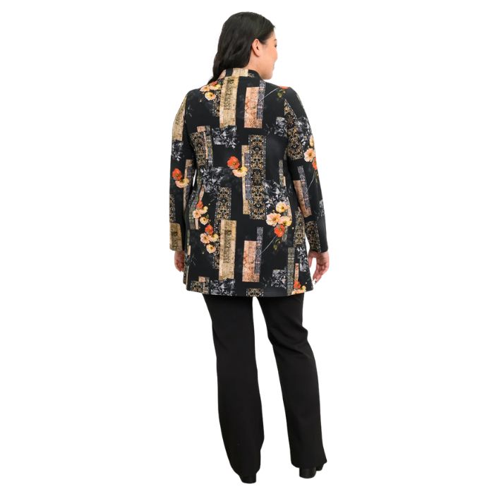 a woman wearing golden garden print edwina tunic top and black daya pants back view set on a studio white background
