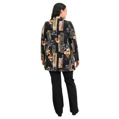 a woman wearing golden garden print edwina tunic top and black daya pants back view set on a studio white background