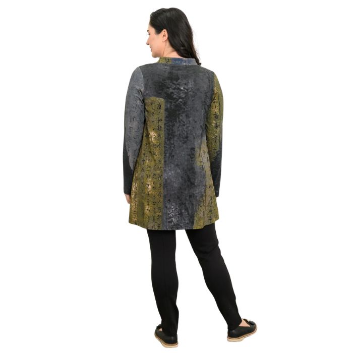 a woman wearing rustic khaki print edwina tunic top and black nadia pants back view set on a studio white background