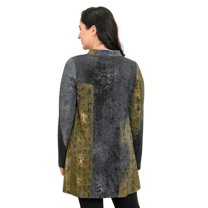a woman wearing rustic khaki print edwina tunic waist up back view set on a studio white background