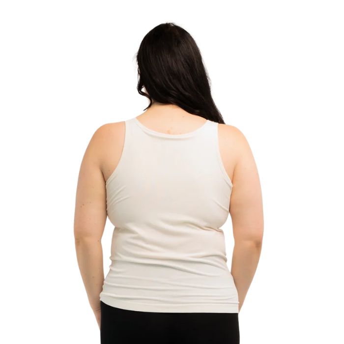 female model wearing cream white effortless bra in tank top back view on white background
