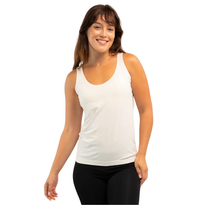 female model wearing cream white effortless bra in tank top front view on white background