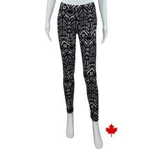 bottom of white mannequin wearing geometric elle full length leggings front view on white background