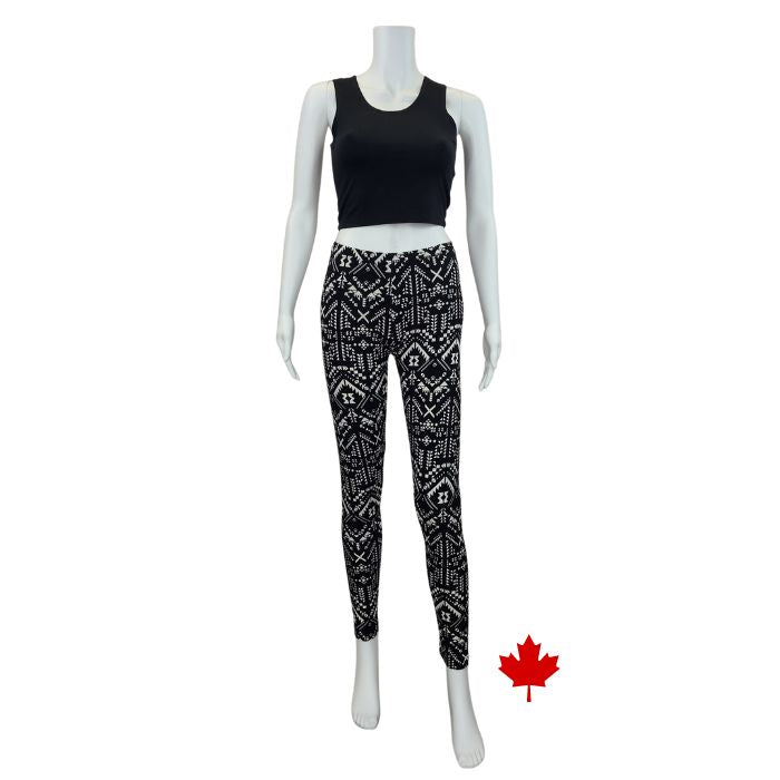 white mannequin wearing geometric elle full length leggings and black stephanie crop tank top front view on white background