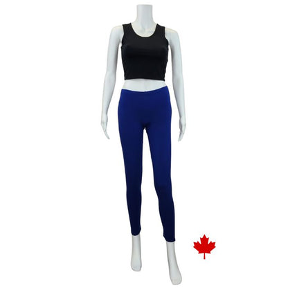white mannequin wearing black elle full length leggings and indigo blue stephanie crop tank top front view on white background