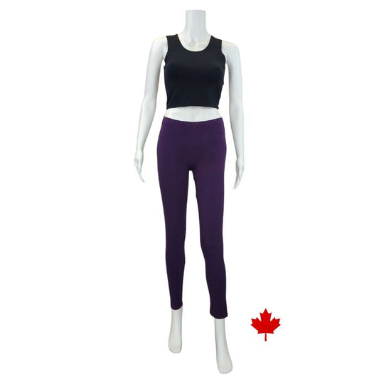 white mannequin wearing plum purple elle full length leggings and black stephanie crop tank top front view on white background