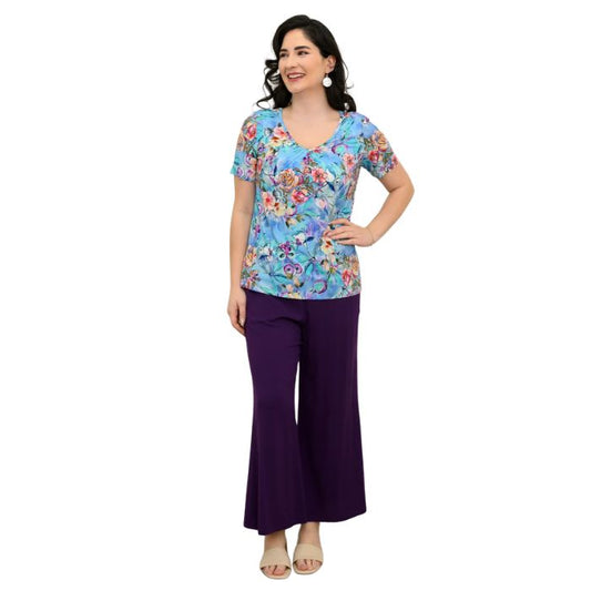 female model wearing teal nectar print emery top and royale purple landon capri pants front view on white background