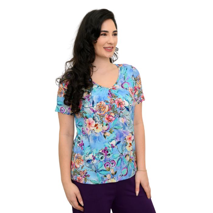 female model wearing teal nectar print emery top front view on white background