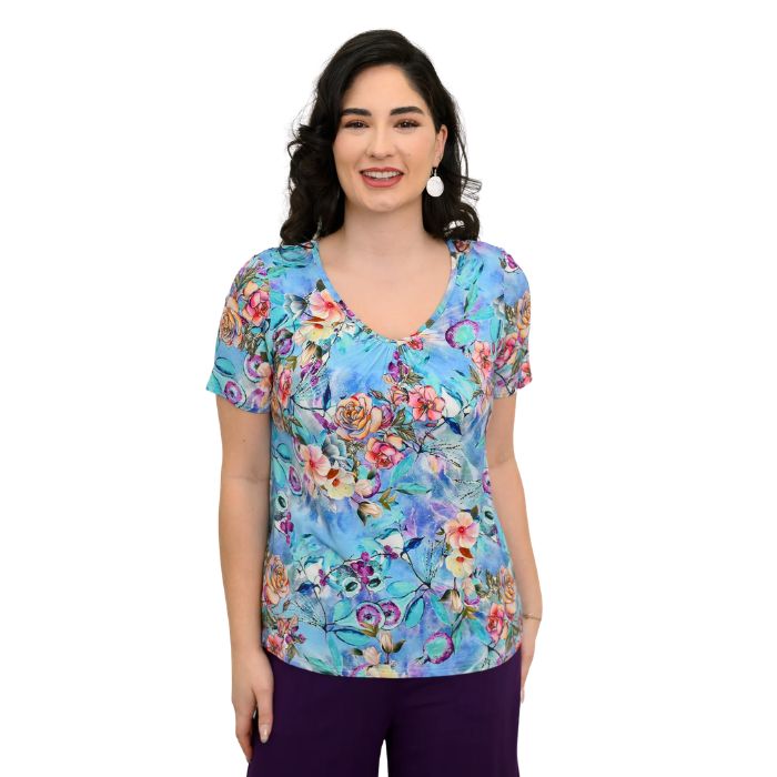 female model wearing teal nectar print emery top front view on white background
