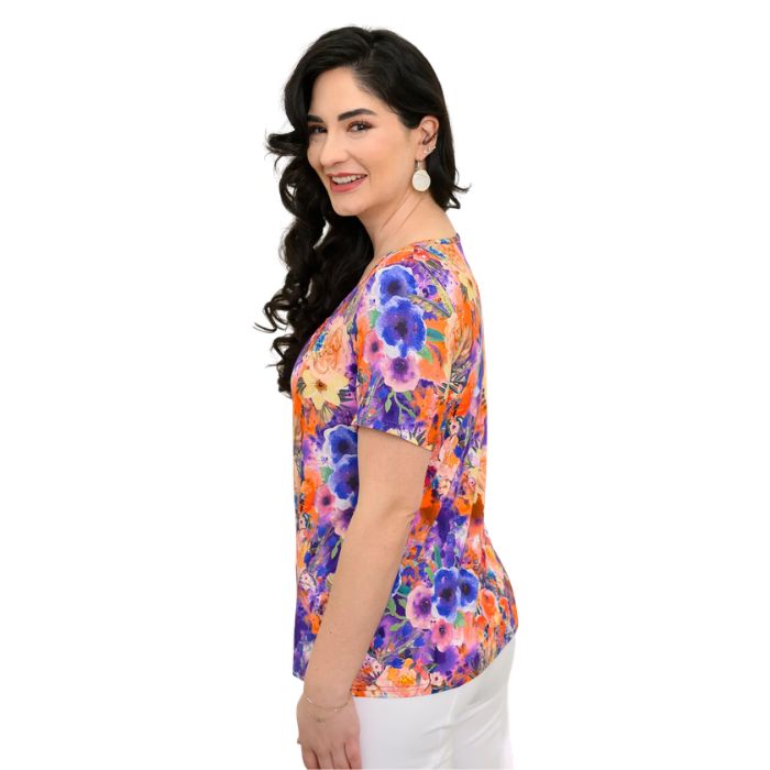 female model wearing violet fiesta print emery top side view on white background