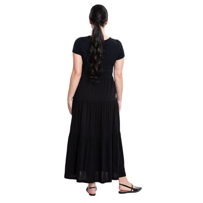 female model wearing black erin dress back view on white background