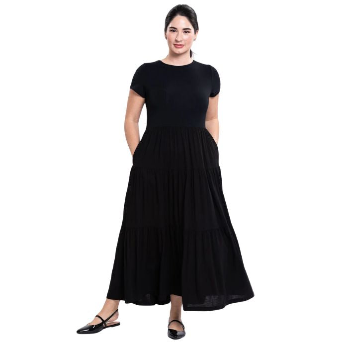 female model wearing black erin dress front view on white background