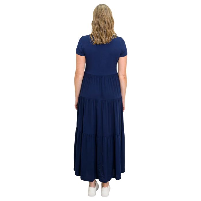 female model wearing indigo blue erin dress back view on white background
