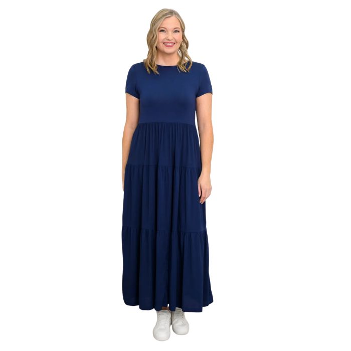 female model wearing indigo blue erin dress front view on white background