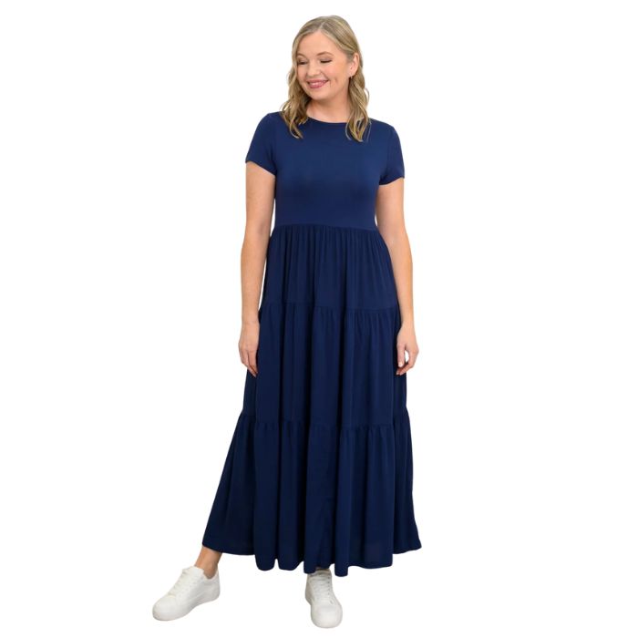 female model wearing indigo blue erin dress front view on white background