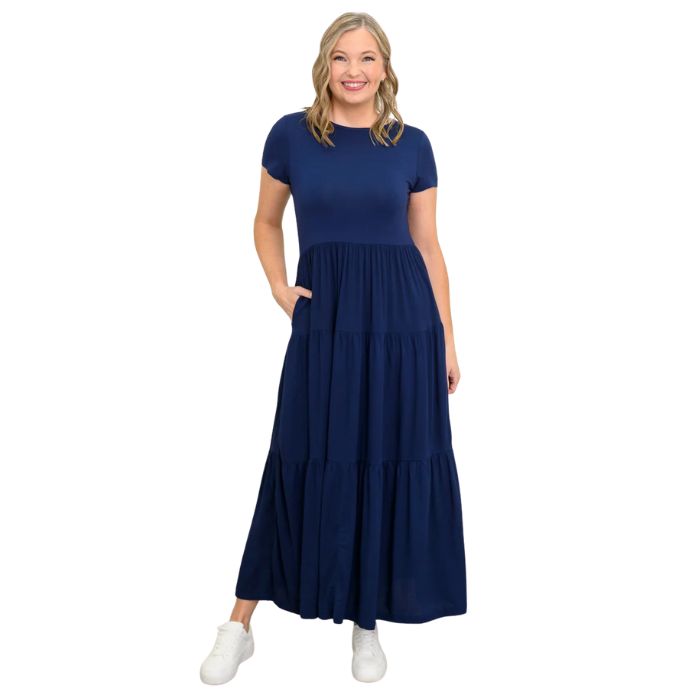 female model wearing indigo blue erin dress front view on white background