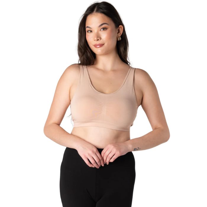 female model wearing beige brown essential bralette front view on white background