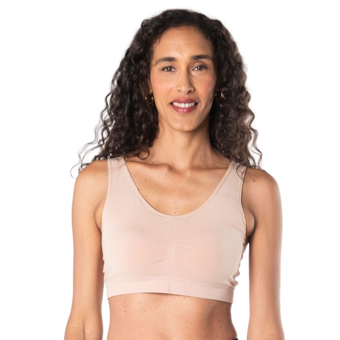 female model wearing beige brown essential bralette front view on white background