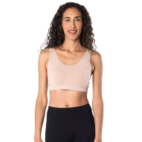 top of female model wearing beige brown essential bralette front view on white background