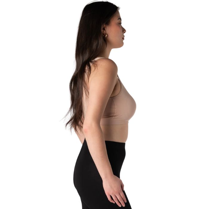 female model wearing beige brown essential bralette side view on white background