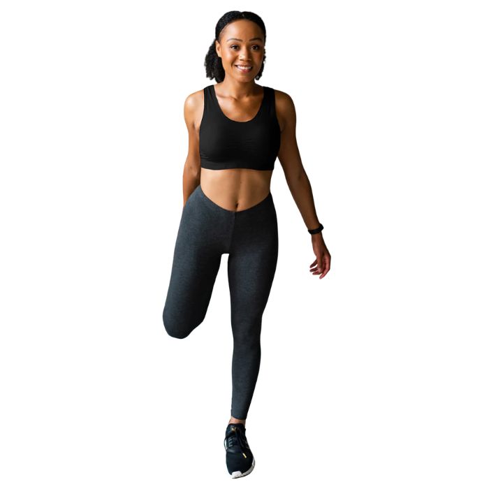 female model wearing black essential bralette and charcoal grey suri leggings front view on white background