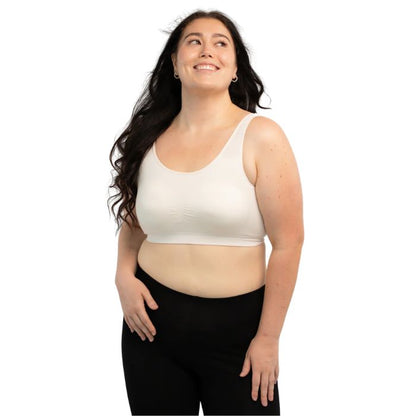 female model wearing cream white essential bralette front view on white background
