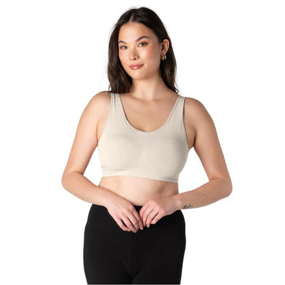 female model wearing cream white essential bralette front view on white background