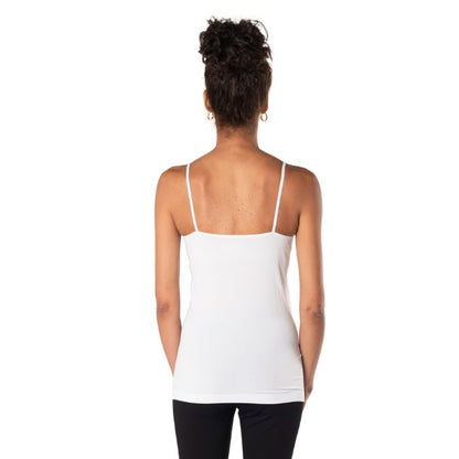 top of female model wearing white essential cami tank top back view on white background