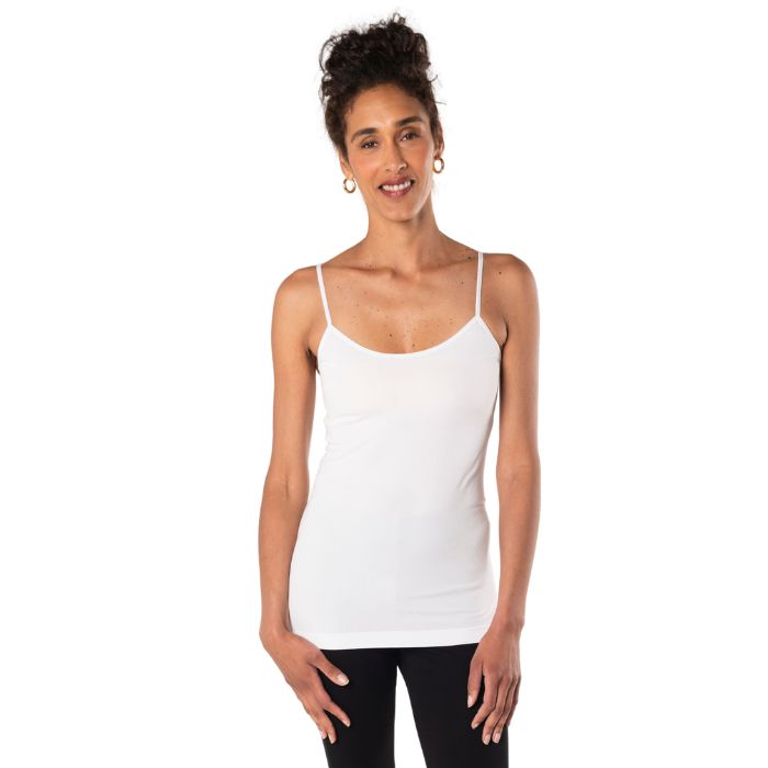 top of female model wearing white essential cami tank top front view on white background