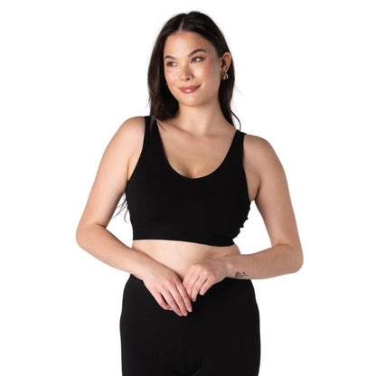 female model wearing black terrera essential v-neck bralette front view on white background