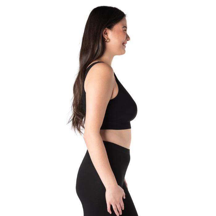 female model wearing black terrera essential v-neck bralette side view on white background