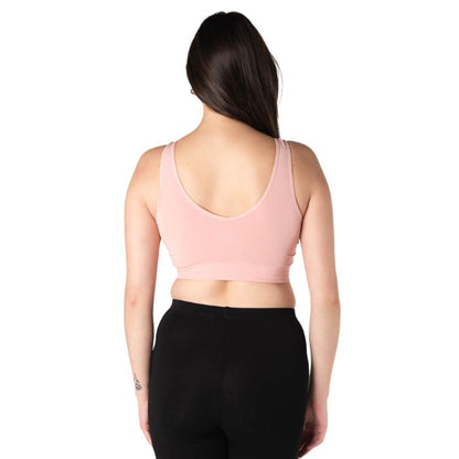female model wearing pink terrera essential v-neck bralette back view on white background
