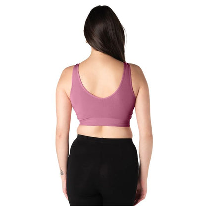 female model wearing wild rose pink terrera essential v-neck bralette back view on white background