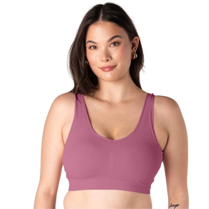 female model wearing wild rose pink terrera essential v-neck bralette front view on white background