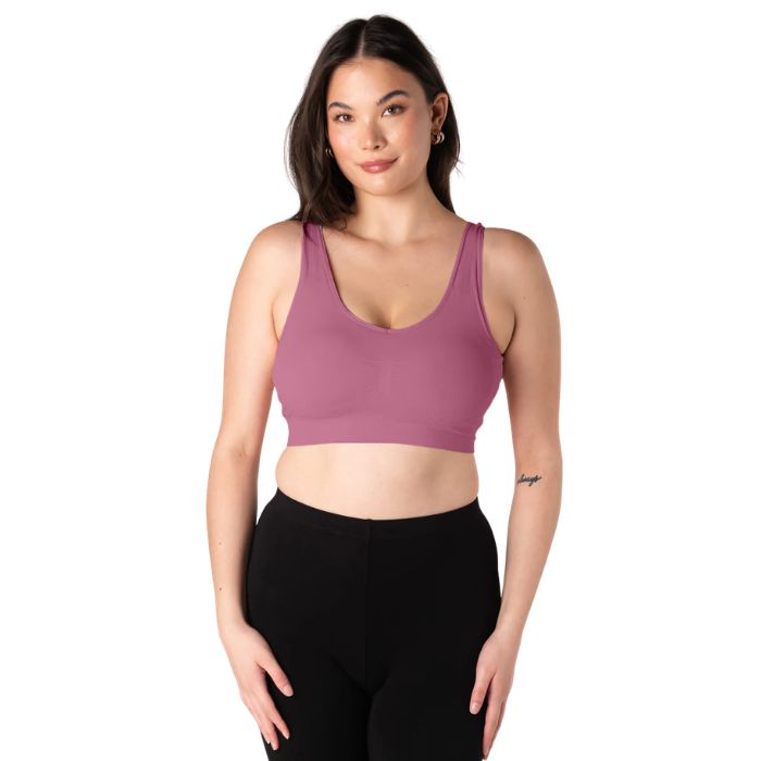 female model wearing wild rose pink terrera essential v-neck bralette front view on white background