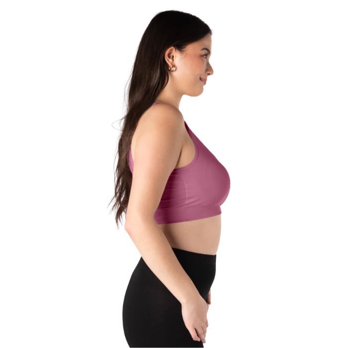 female model wearing wild rose pink terrera essential v-neck bralette side view on white background