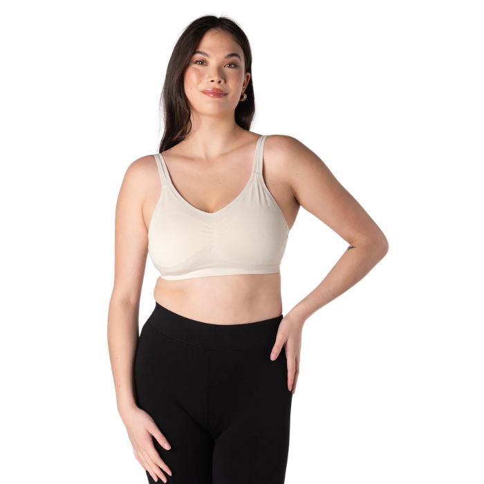 female model wearing cream white everyday adjustable bralette front view on white background