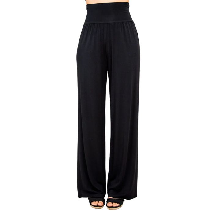 female model wearing black gaylene pants front view on white background