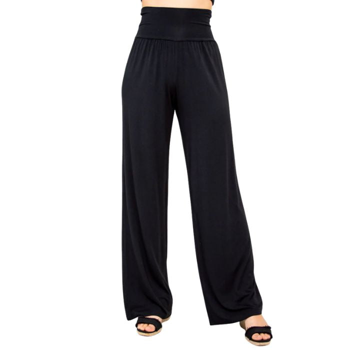 female model wearing black gaylene pants front view on white background
