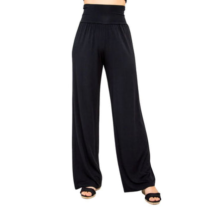 female model wearing black gaylene pants front view on white background