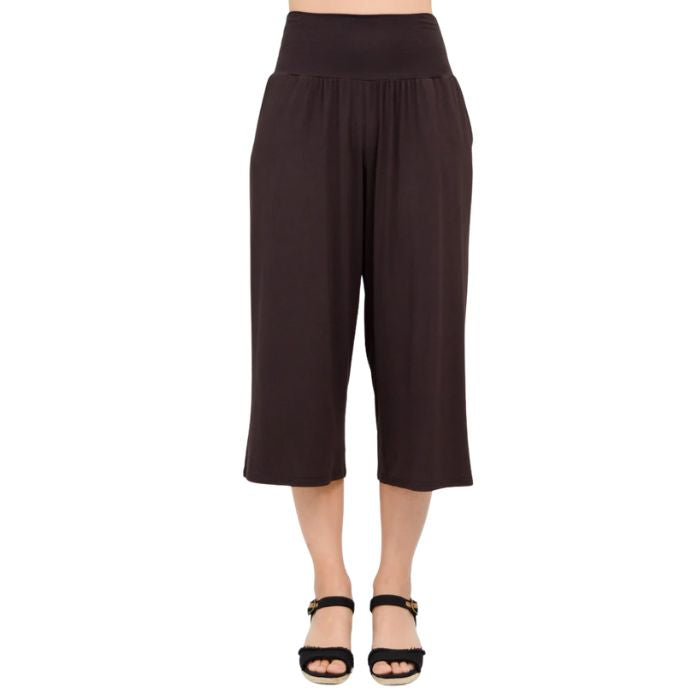female model wearing coffee brown gaylene capri pants front view on white background