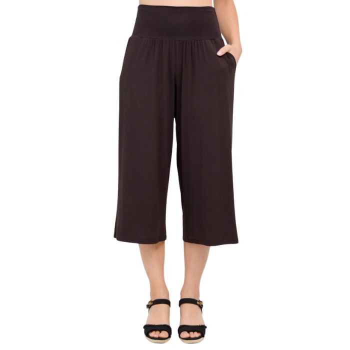 female model wearing coffee brown gaylene capri pants front view on white background