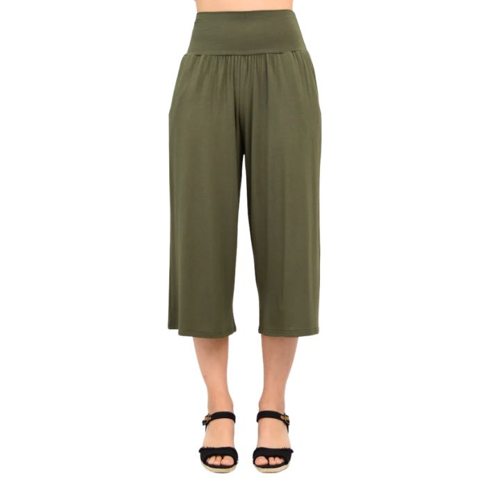 female model wearing khaki green gaylene capri pants front view on white background